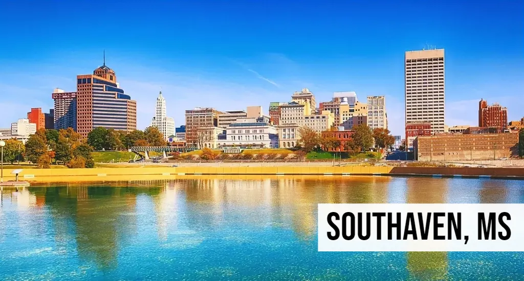 Southaven, Mississippi city skyline view with waterfront, buildings, reflection on water, and surrounding urban area