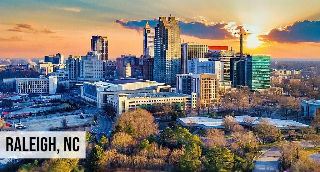 Raleigh, North Carolina aerial view of downtown skyline with government buildings, streets, and surrounding city area