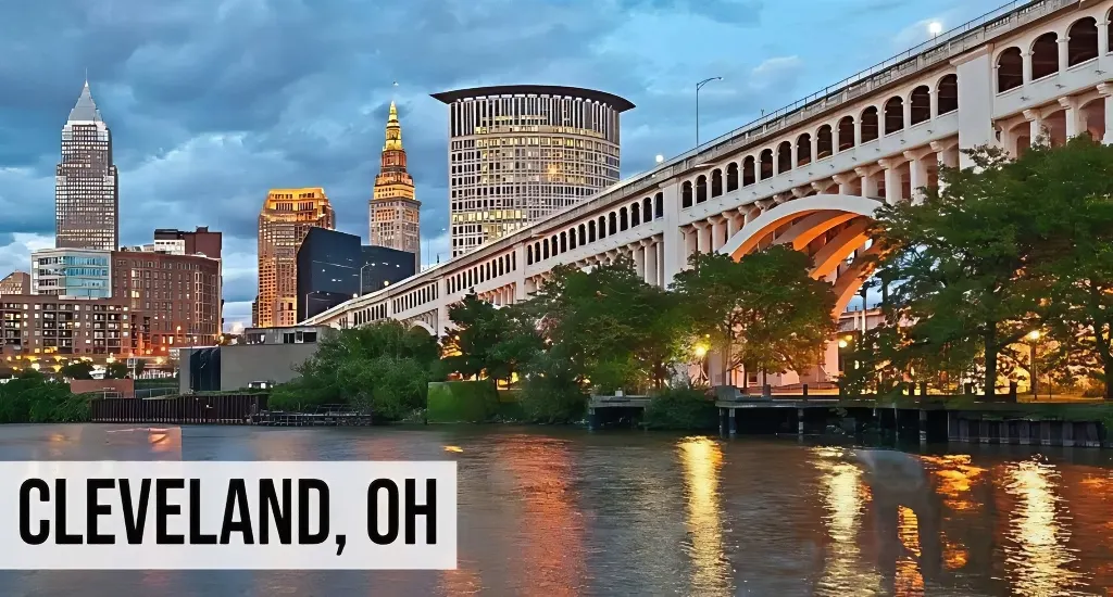 Cash Offer for Land Ohio – Cleveland, OH Cleveland, Ohio city skyline view along the waterfront with downtown buildings, bridges, river, and surrounding cityscape