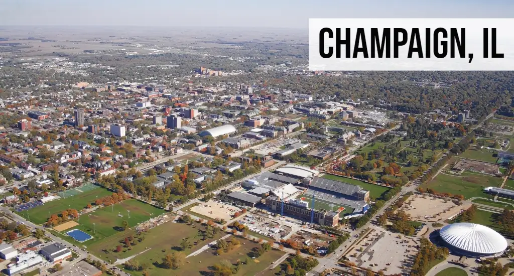 Champaign, Illinois aerial view of downtown streets, university campus buildings, and surrounding development