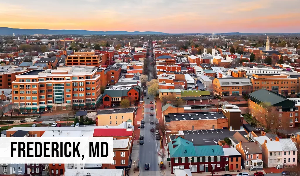Frederick, Maryland aerial view of historic downtown with brick buildings, streets, and surrounding city area