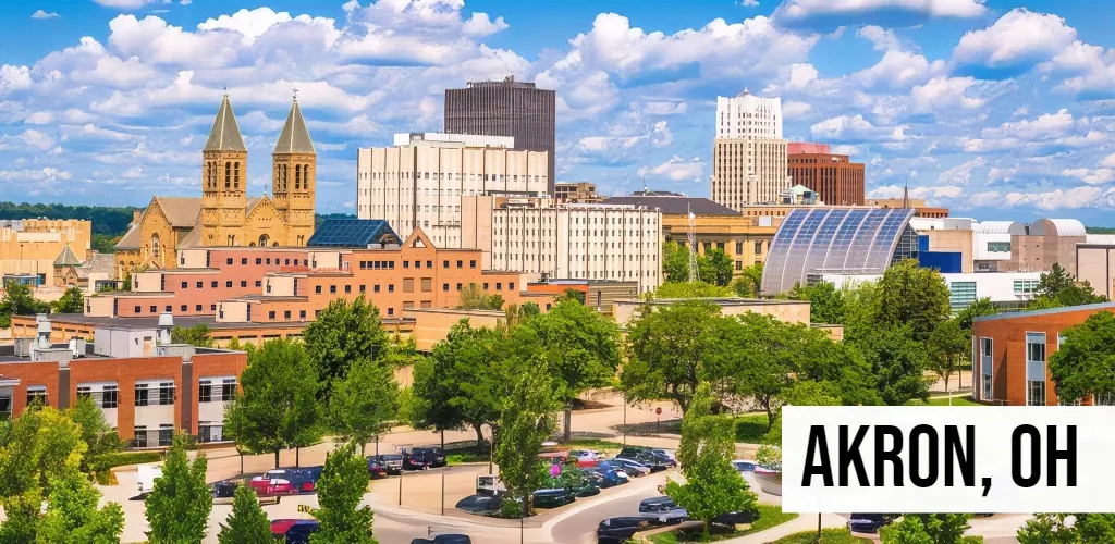 Land Buyers in Ohio – Akron, OH Akron, Ohio aerial view of central city with mid-rise buildings, street grid, commercial areas, and surrounding neighborhoods