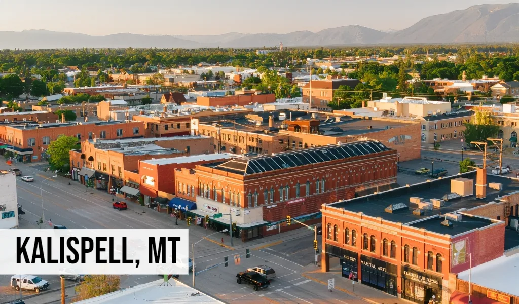 Kalispell, Montana aerial view of downtown with historic buildings and surrounding residential development