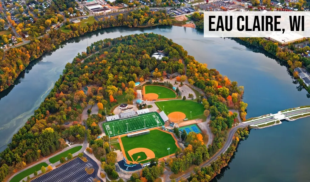 Eau Claire, Wisconsin aerial view of river bend with parkland, sports fields, waterway, and surrounding neighborhood