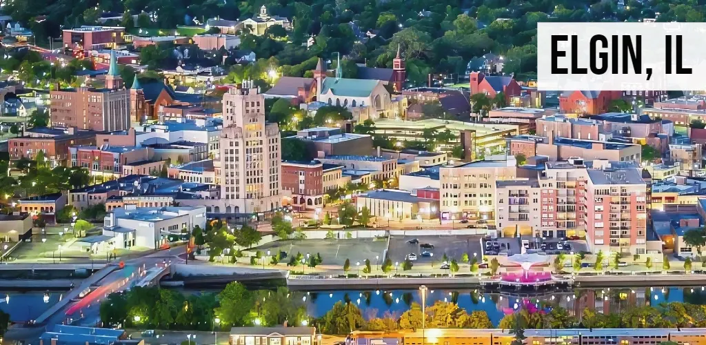 Elgin, Illinois aerial view of downtown buildings, riverfront, and surrounding neighborhoods