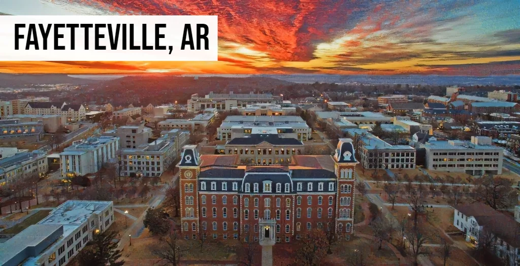 Sell My Land Arkansas – Fayetteville, AR Fayetteville, Arkansas aerial view of downtown with university buildings and surrounding development