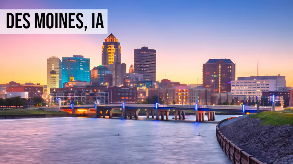 Sell My Land Iowa – Des Moines, IA Des Moines, Iowa aerial view of downtown skyline along the Des Moines River at sunset