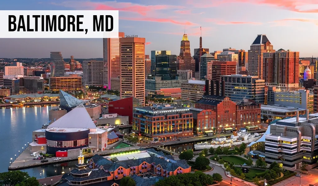 Baltimore, Maryland downtown waterfront skyline with harbor, city buildings, roads, and surrounding urban area