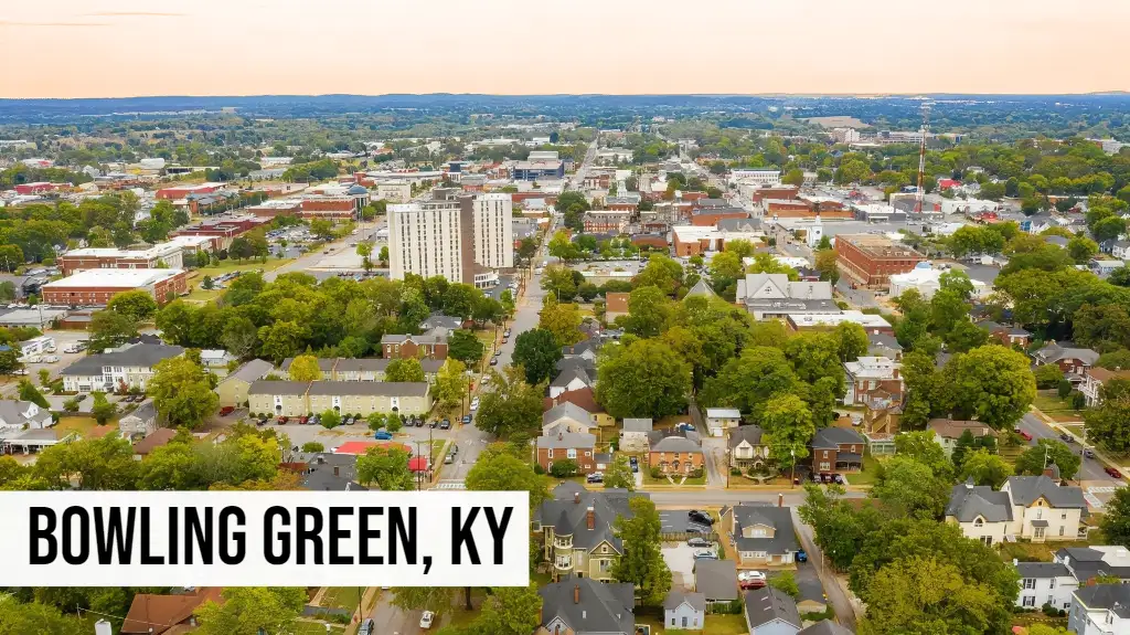 We Buy Land Kentucky – Bowling Green, KY Bowling Green, Kentucky aerial view of downtown with residential neighborhoods, tree-lined streets, and city buildings