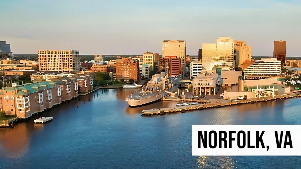 Norfolk, Virginia downtown waterfront skyline featuring harbor views, commercial buildings, piers, and surrounding urban district