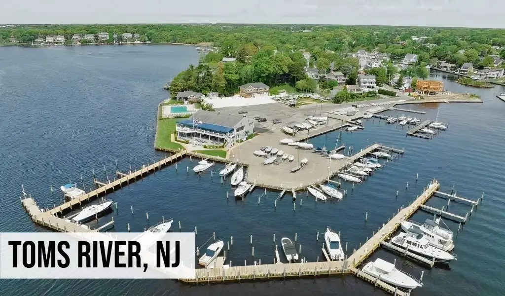Toms River, New Jersey aerial view of marina with boats, docks, waterfront, and surrounding coastal area