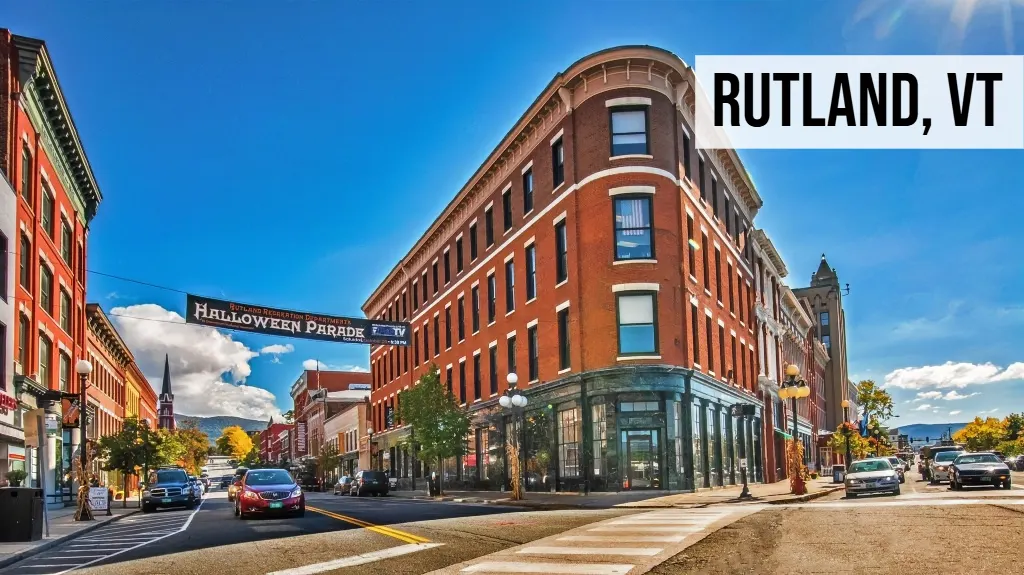 Rutland, Vermont downtown street view with historic brick buildings, storefronts, cars, and sidewalks