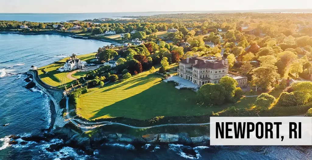 Newport, Rhode Island coastal aerial view with historic mansion, shoreline, ocean, and surrounding landscape