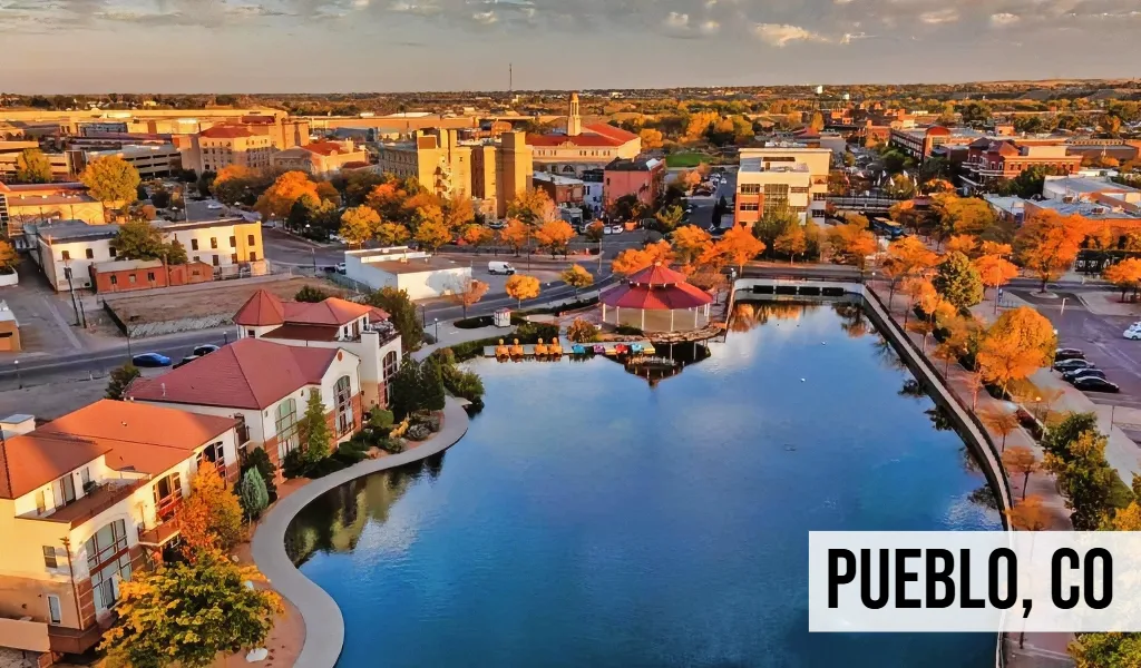 Pueblo, Colorado aerial view of downtown along the river with buildings, waterway, and surrounding city area