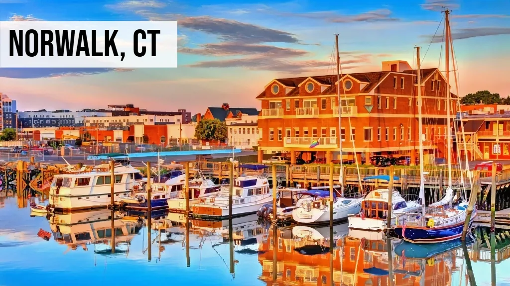 Norwalk, Connecticut waterfront harbor view with boats, docks, marina buildings, and surrounding coastal area