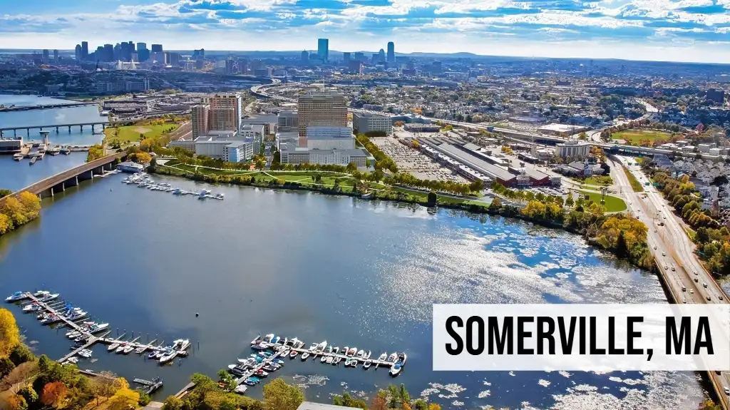 Somerville, Massachusetts aerial view of urban neighborhood with waterway, buildings, roads, and surrounding city area