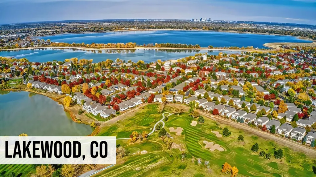 Lakewood, Colorado aerial view of residential neighborhoods with lake, green spaces, homes, and surrounding suburban area